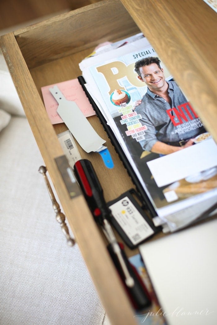 Looking inside a messy office desk.