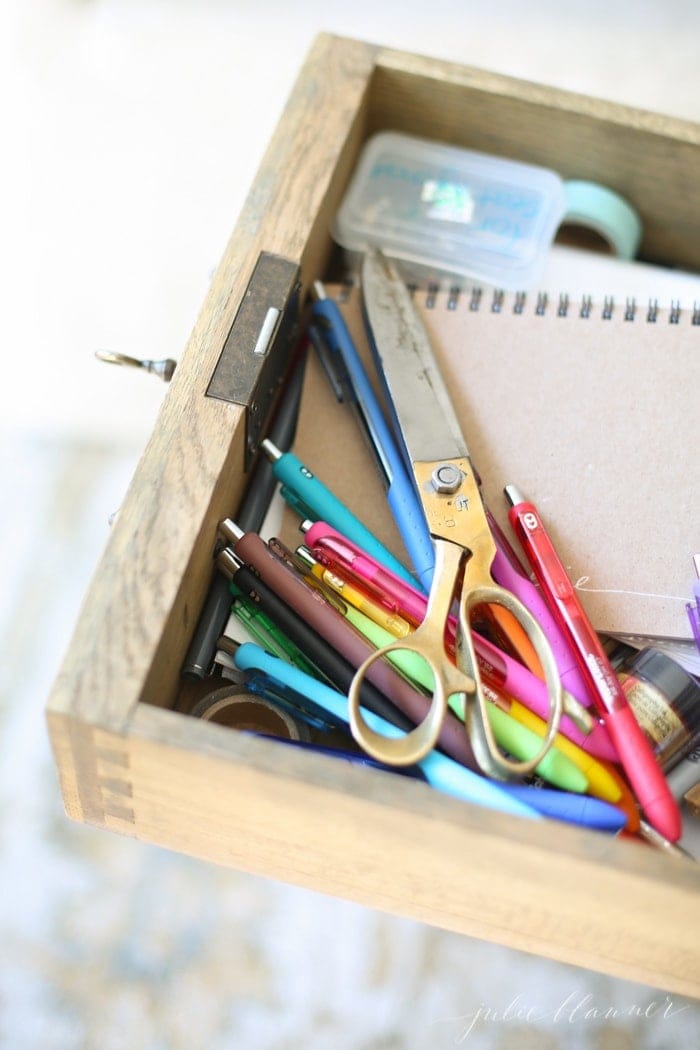 Looking inside a messy office desk.