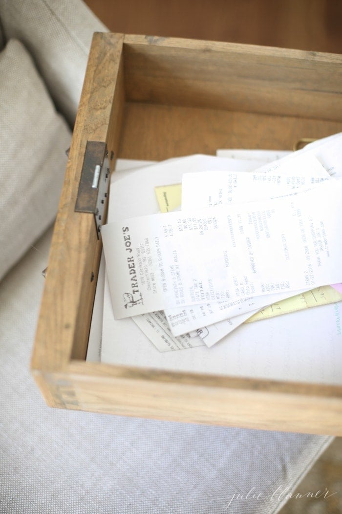 A messy desk drawer full of receipts before a full home office organization.