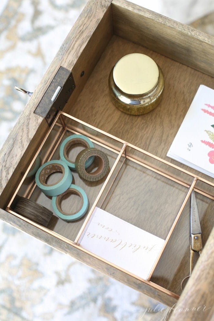 Inside a beautifully organized desk drawer with desk organization ideas.