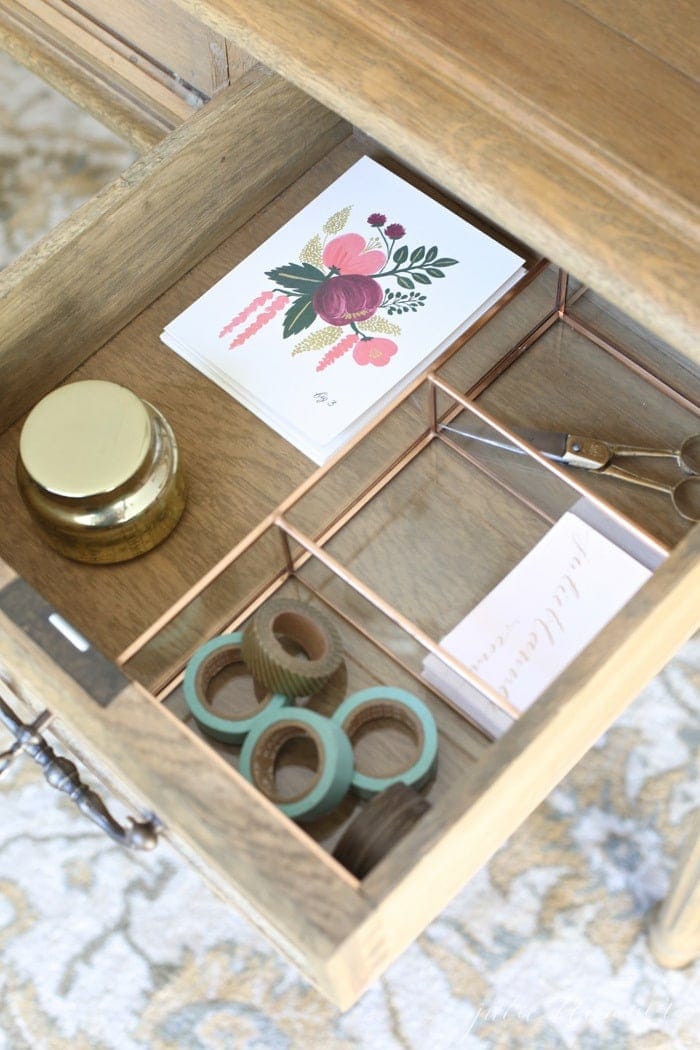 Inside a beautifully organized desk drawer with desk organization ideas.