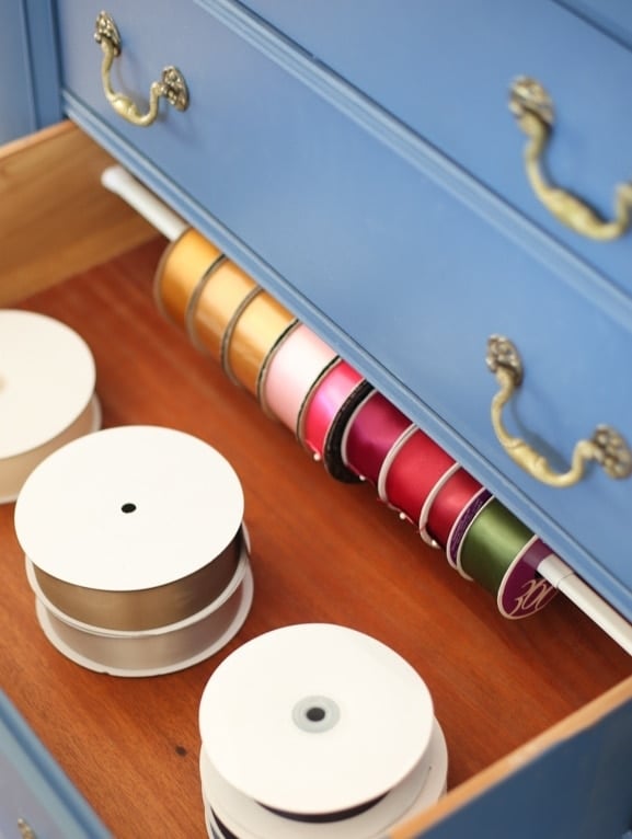 An organized craft drawer full of organized ribbon and more desk organization ideas.