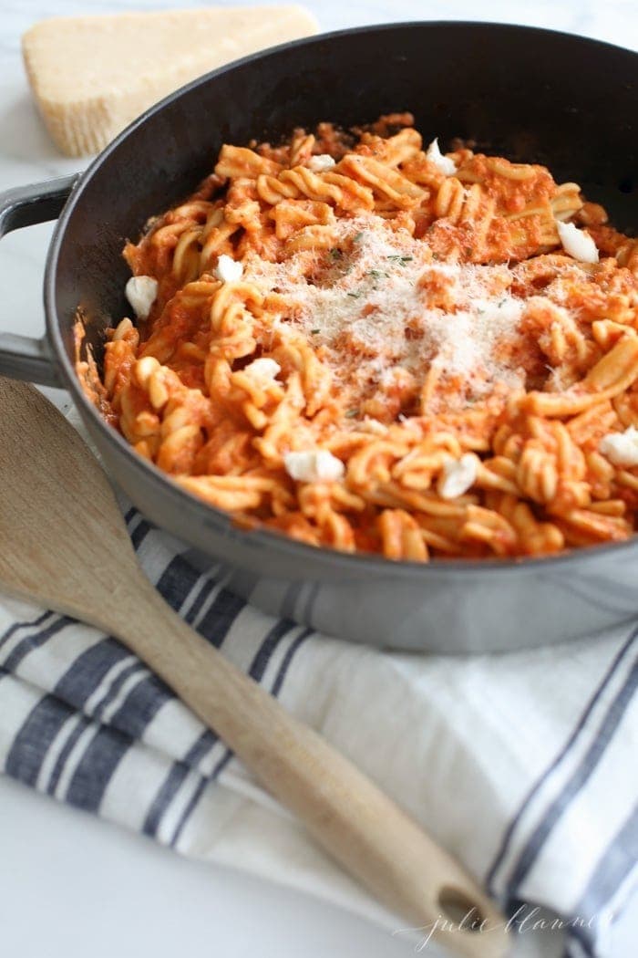 Pasta with vodka sauce in a black pan ready to serve