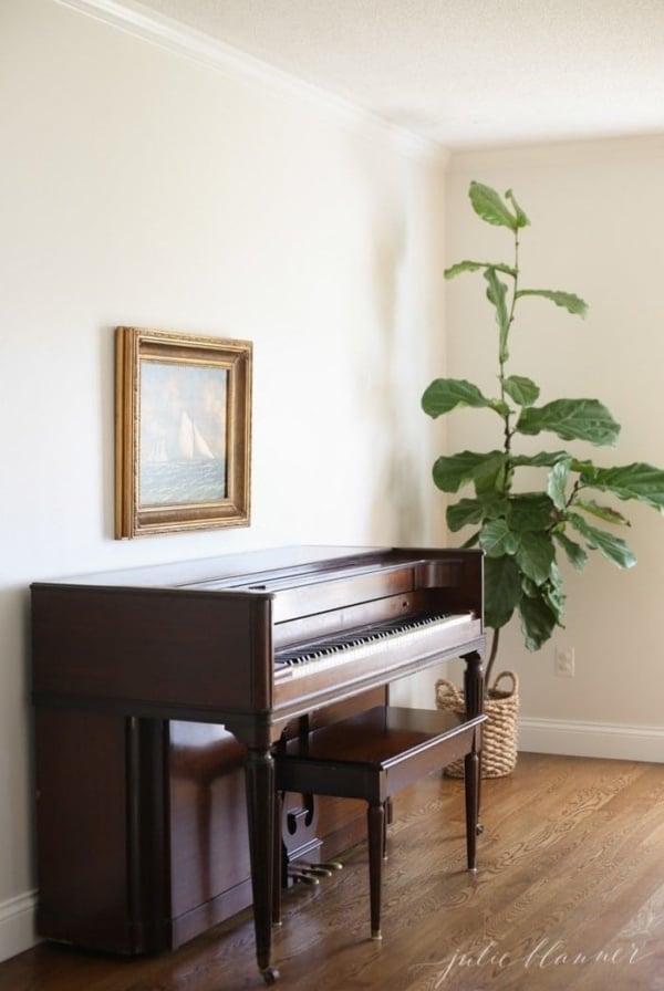 beautiful family room ideas | fiddle fig piano and sailboat painting