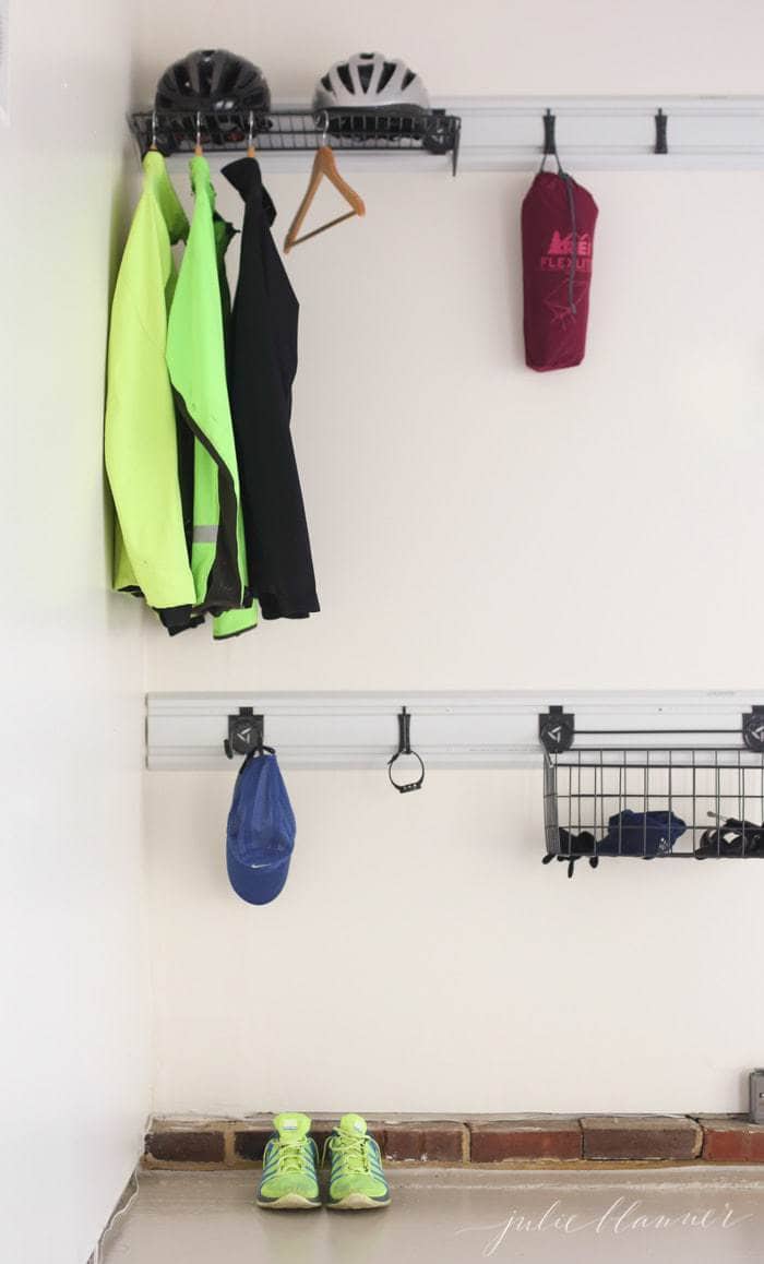 A garage organized with running gear on a hook system