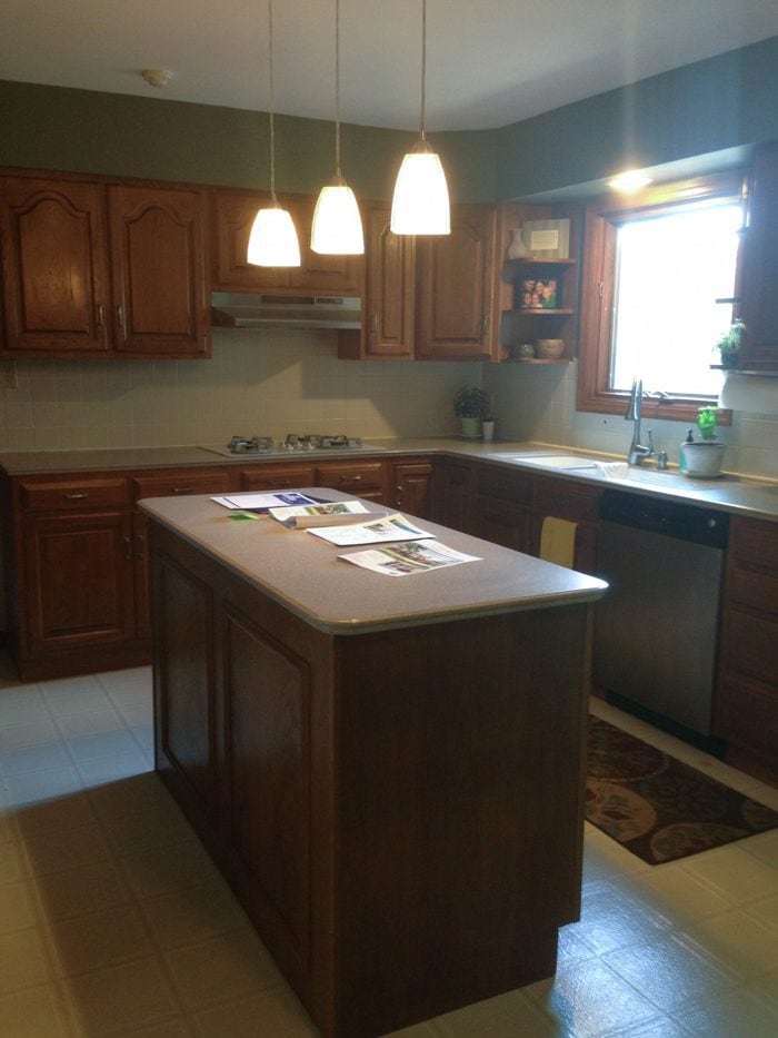 An oak kitchen with dated countertops