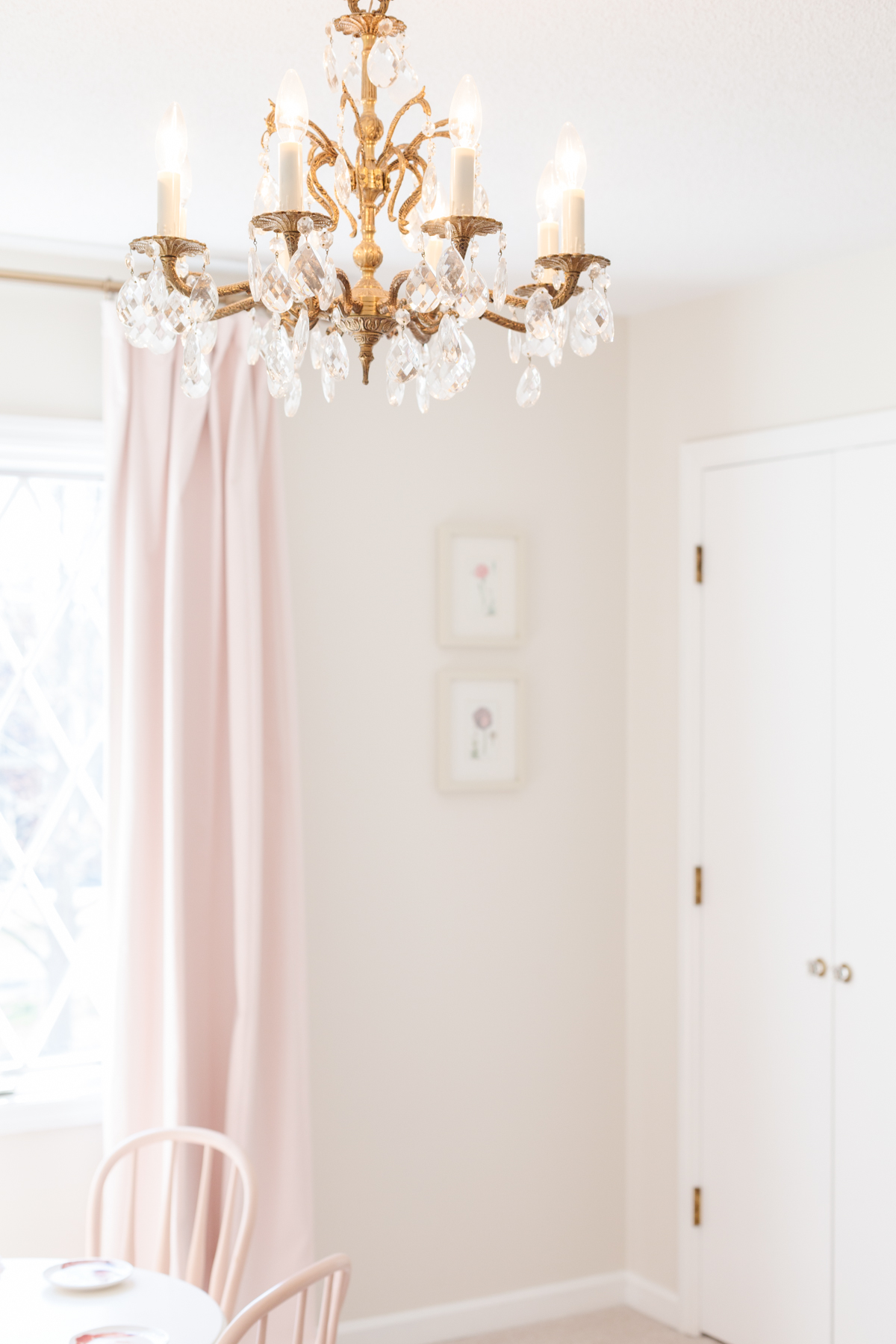 a white painted child's bedroom with pink curtains in a guide to How to Sell a House Fast.