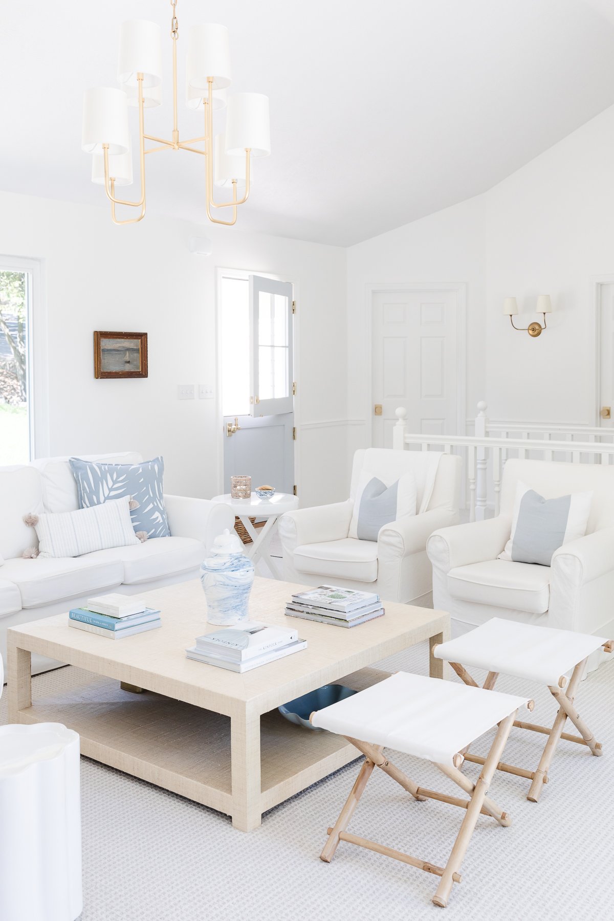A white living room with white furniture