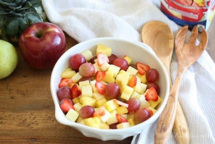 Fruit salad served in a white bowl