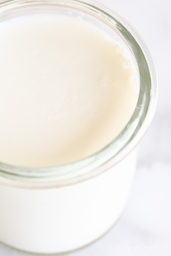 closeup on buttermilk in glass container