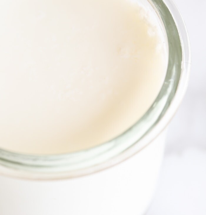 closeup on buttermilk in glass container