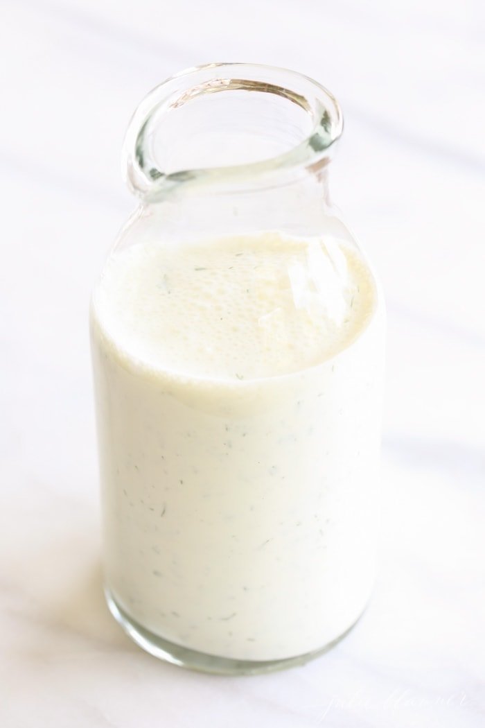 Healthy homemade ranch dressing in a glass bottle