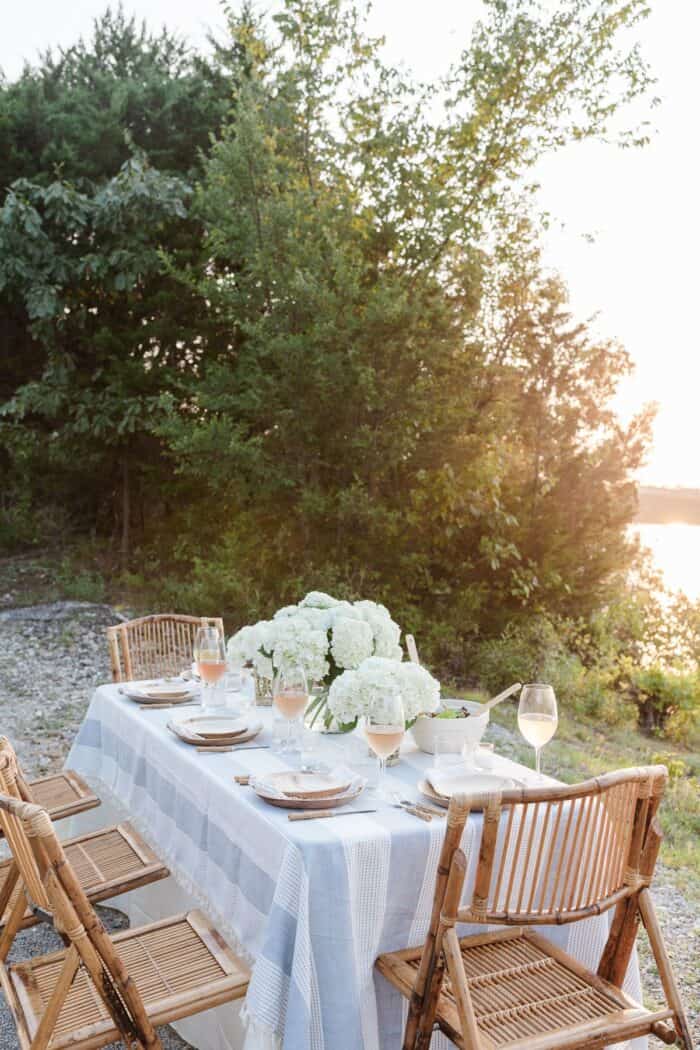 A table set up with water views for al fresco dining.