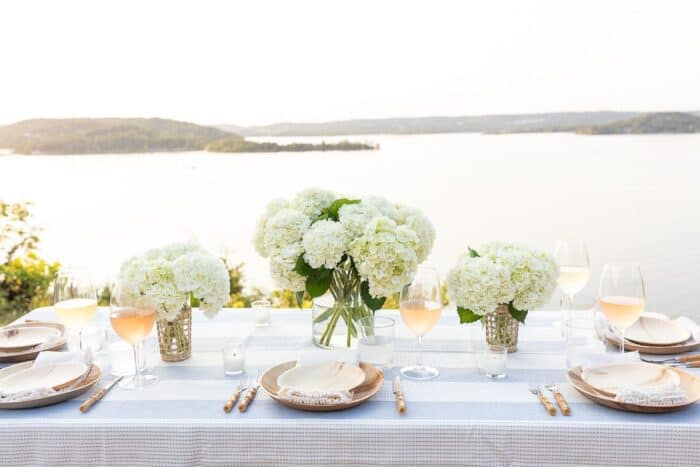 entertaining al fresco for fall A table set up with water views for al fresco dining.