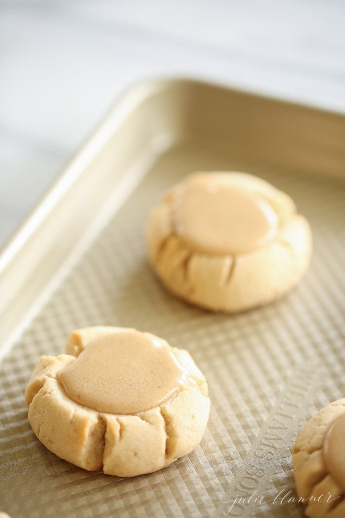 Close up of a salted caramel iced sugar cookie