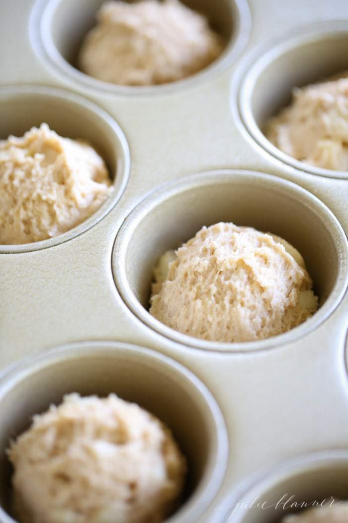 Unbaked dough in a muffin tin