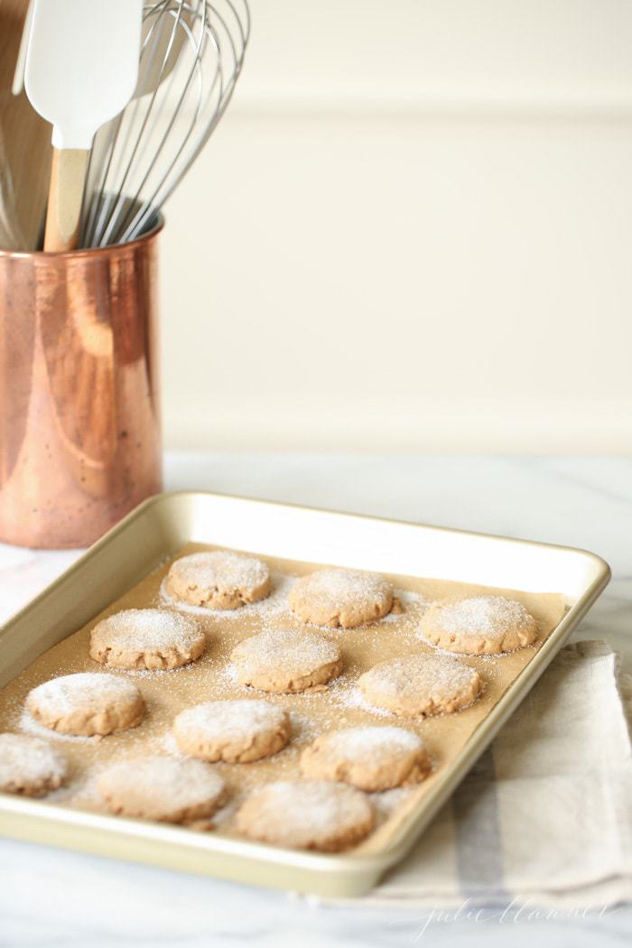 Ssugar and spiced shortbread cookies on a baking sheet