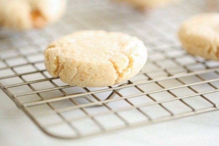 Stuffed caramel cheesecake cookies cooling on a cooling rack.