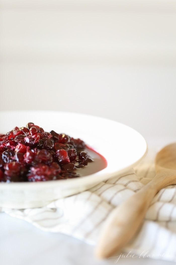 Easy red wine cranberry sauce recipe served in a white bowl