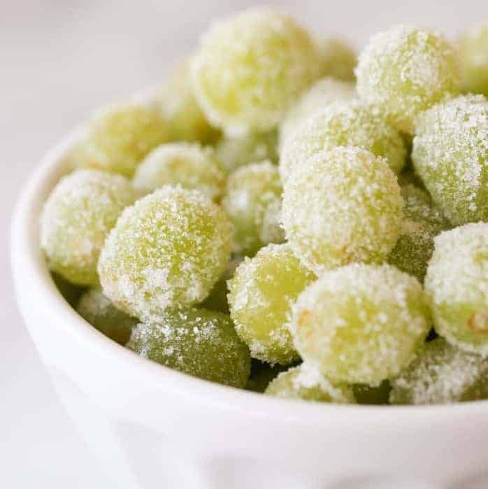 Frozen Prosecco grapes recipe, rolled in sugar in a white bowl