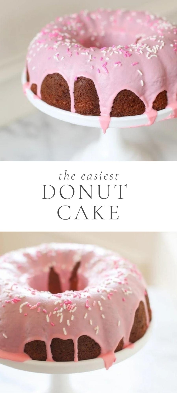 chocolate donut cake with pink frosting on plate and table