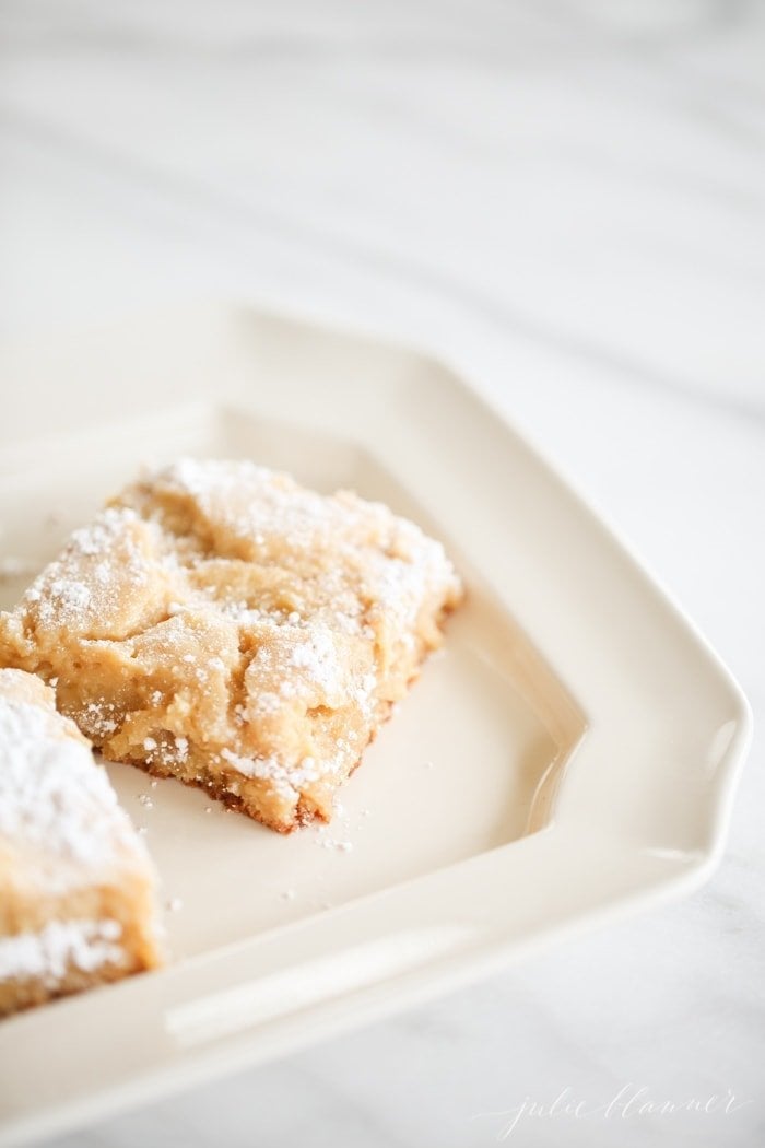 Learn how to make gooey butter cake without a cake mix. This easy made from scratch gooey butter cake recipe will leave you craving more!