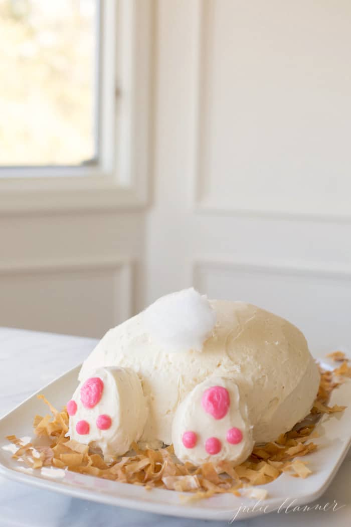 An Easter bunny butt cake on a white platter 