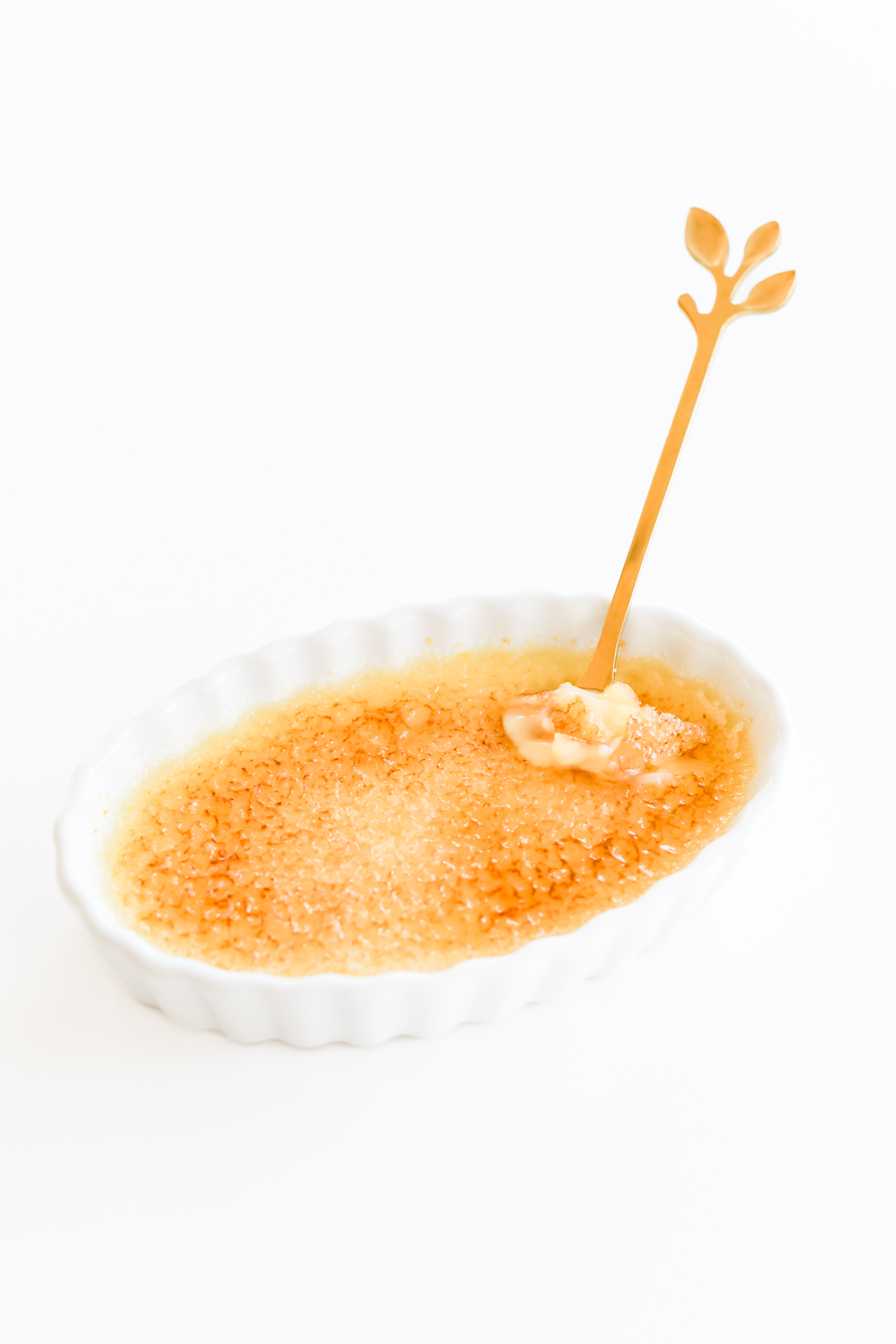 Easy creme brulee with a spoon in a bowl.
