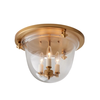 A brass flush mount lantern ceiling light.