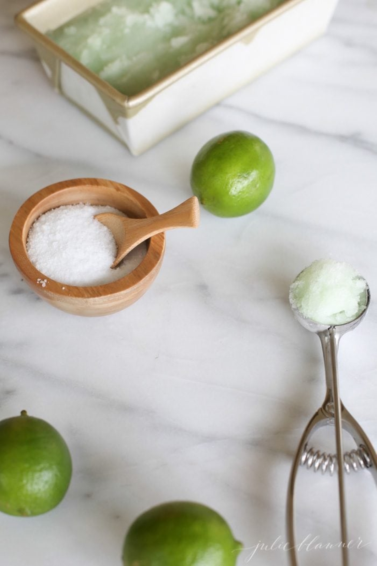 Ingredients for lime sorbet on a marble countertop.