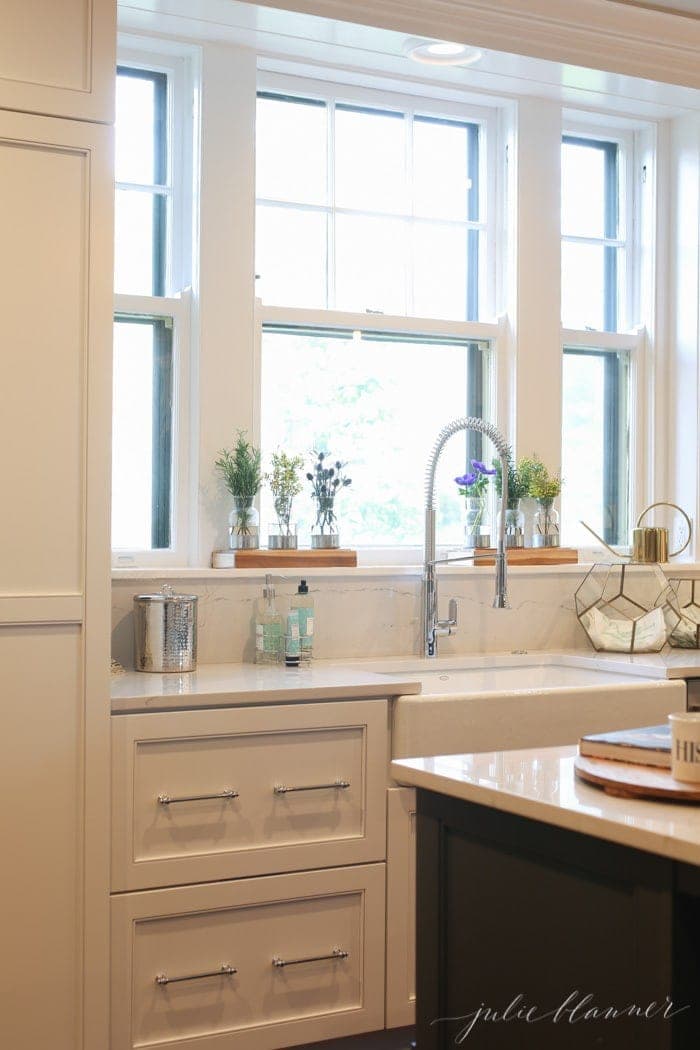 A Modern Kitchen in an Old House, with a large apron front sink and chrome faucet