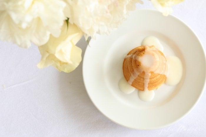 honey lemon cake with lemon glaze on a white plate