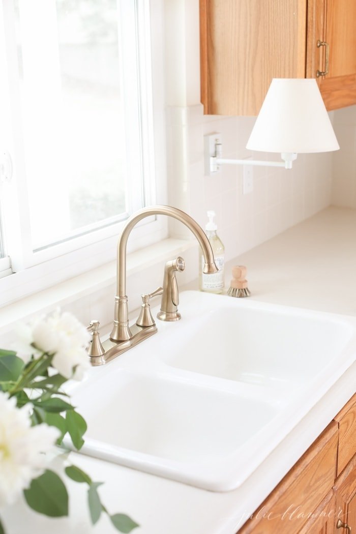 replacing a faucet is an easy and inexpensive way to update a kitchen on a budget