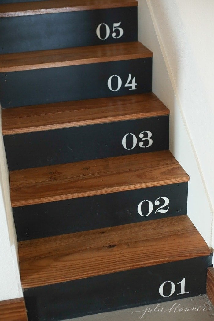 Urban farmhouse style painted steps with stenciled numbers on each tread.