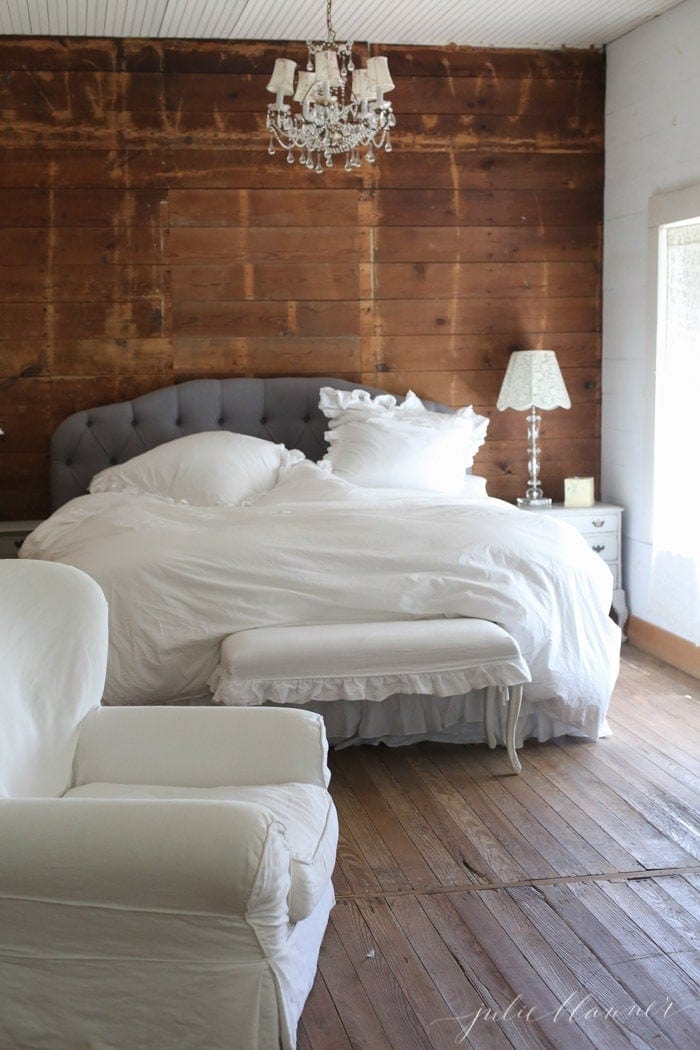 shabby chic bedroom with wood walls and a romantic bedroom color