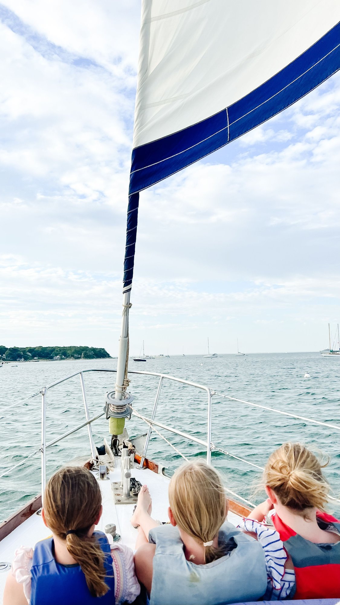 Three girls on a sailboat in Martha's Vineyard