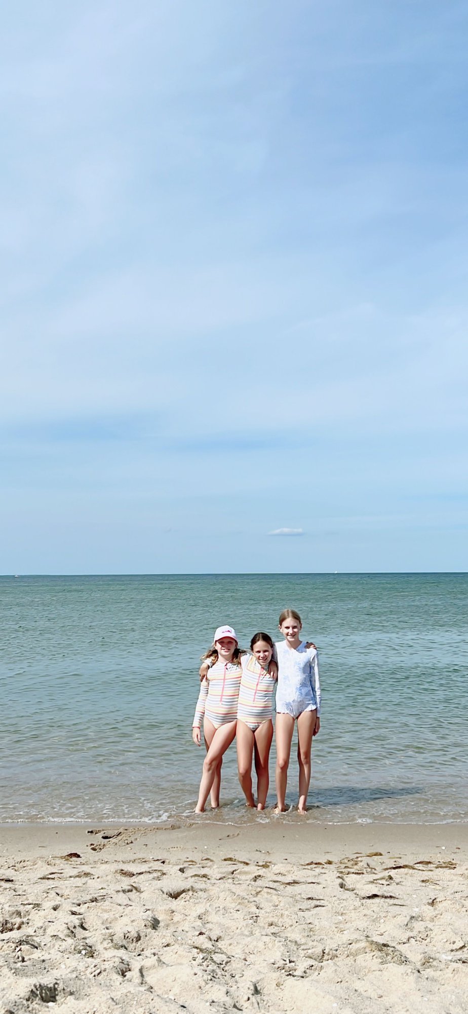 Three little girls on a beach in Martha's Vineyard