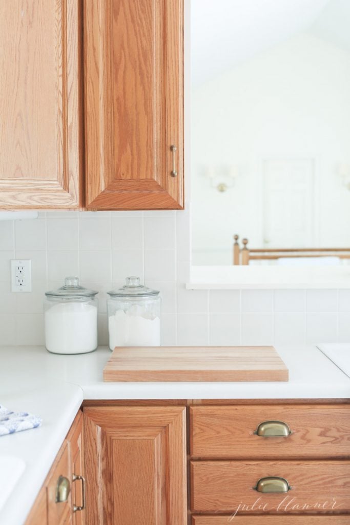 FRAME Dark Oak kitchen cabinets with brass knobs