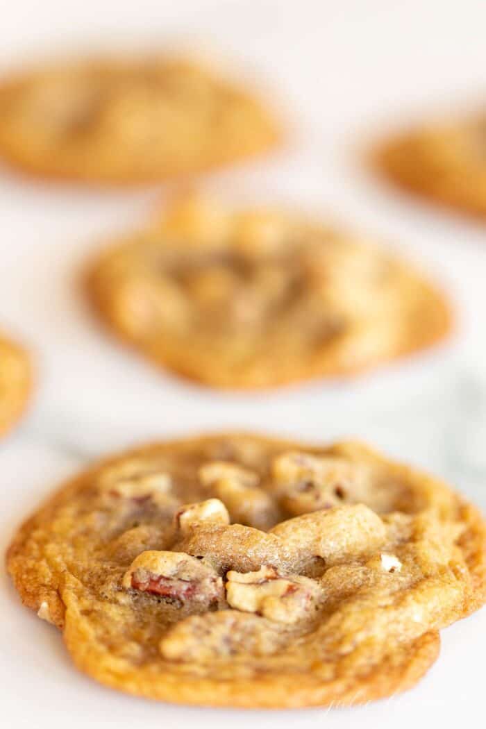 Pecan cookies on a marble surface.
