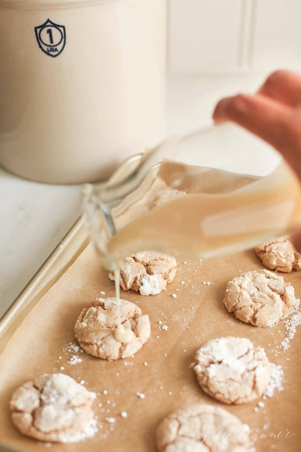 Glaze being poured over the cookies