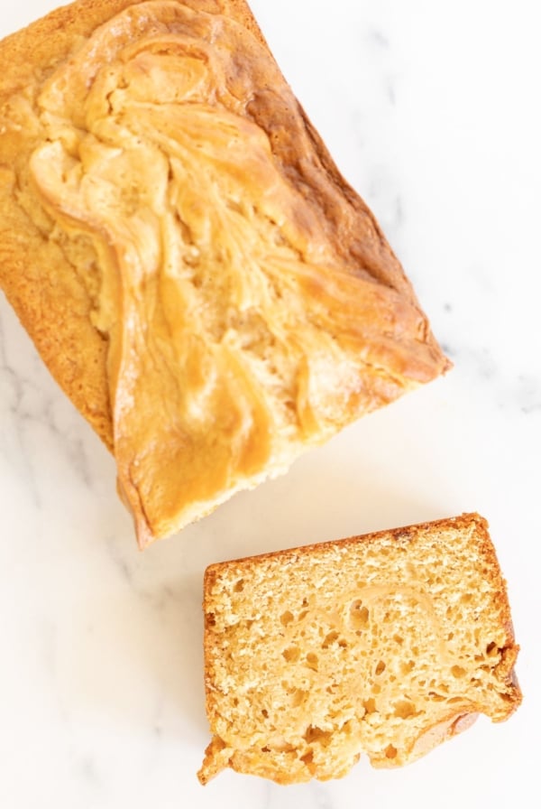 Sliced cream cheese bread with caramel, placed on a marble countertop
