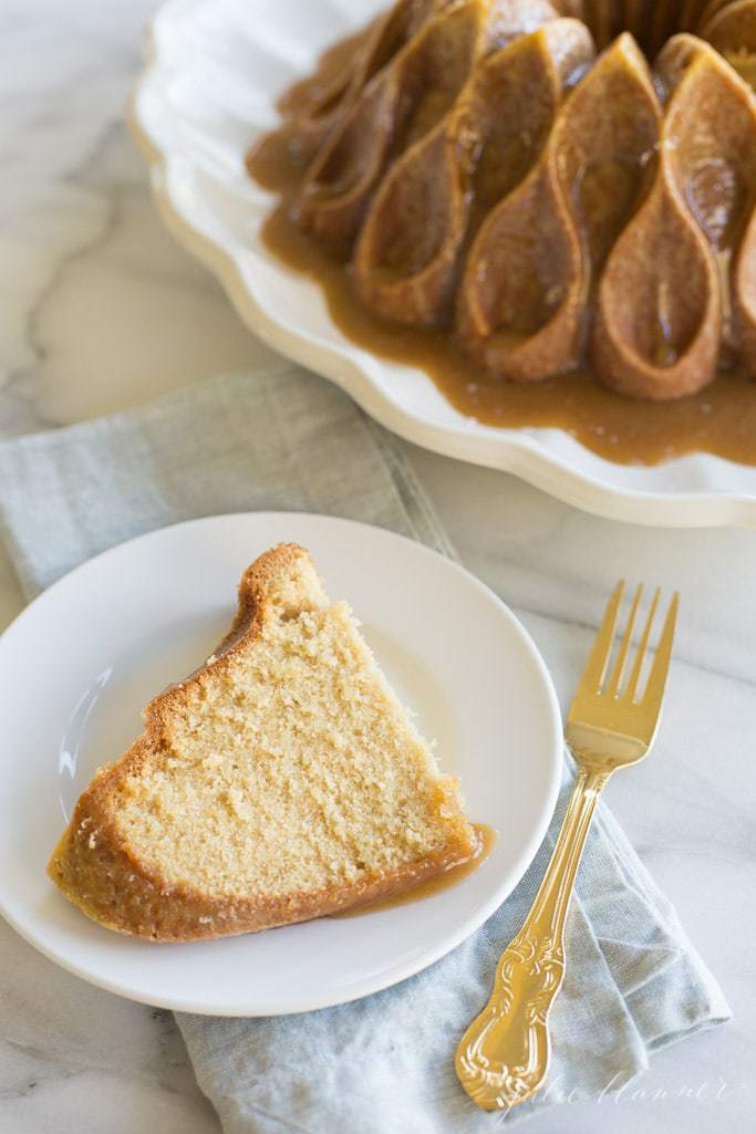 brown sugar cake formed with a bundt pan and topped with salted caramel sauce