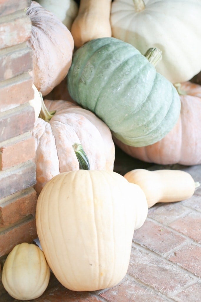 heirloom pumpkins spilling out of a fireplace