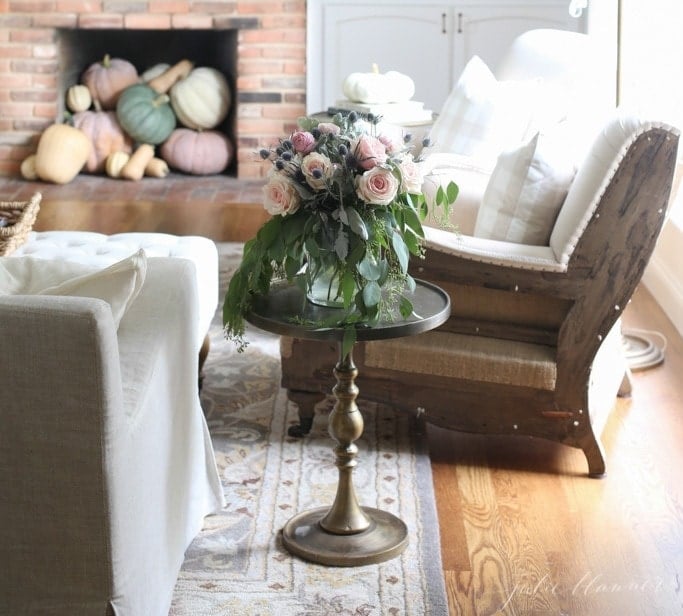 pastel fall decorating ideas with pumpkins in fireplace