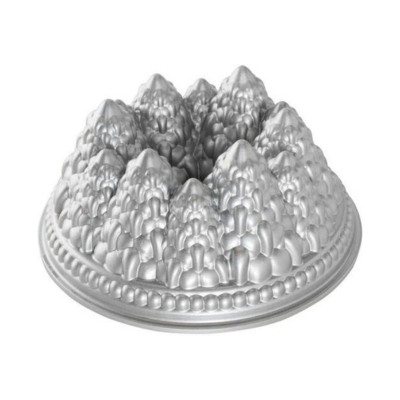 A silver bundt pan with mountains on it, perfect for baking cinnamon pound cake.