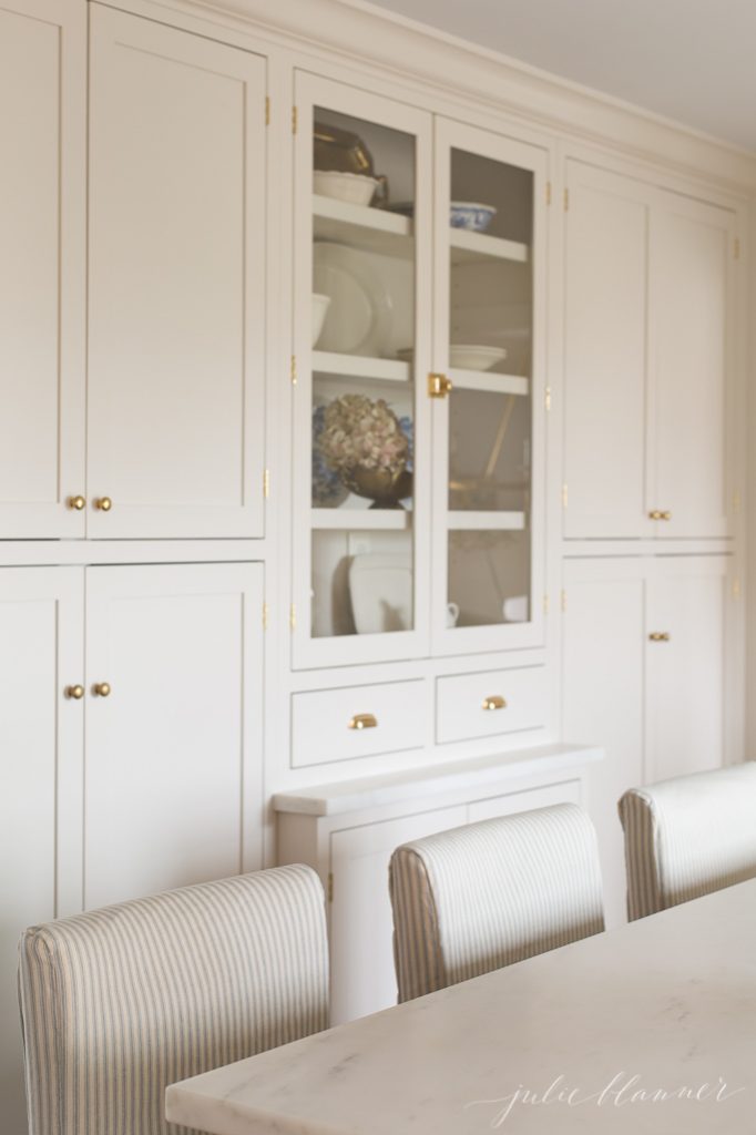 pretty counter stools with ticking stripe slipcovers for farmhouse kitchen