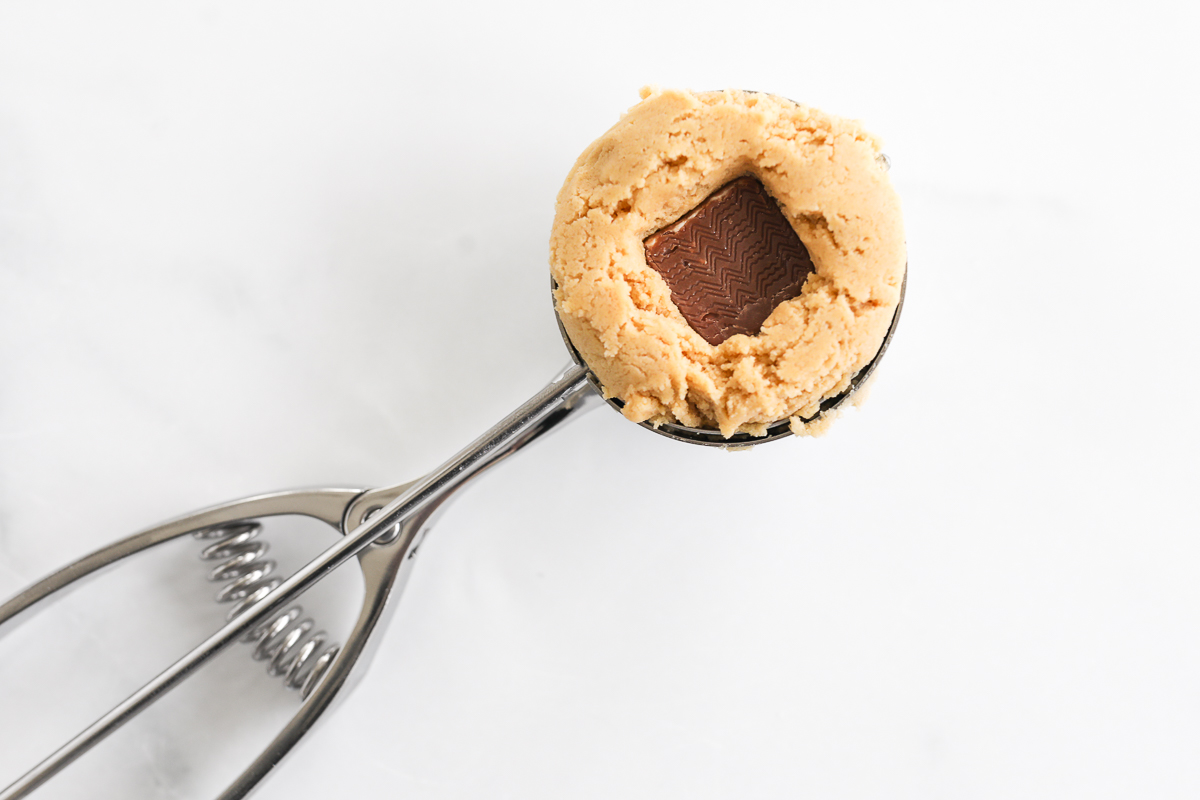 A stuffed peanut butter cookie on a spoon.