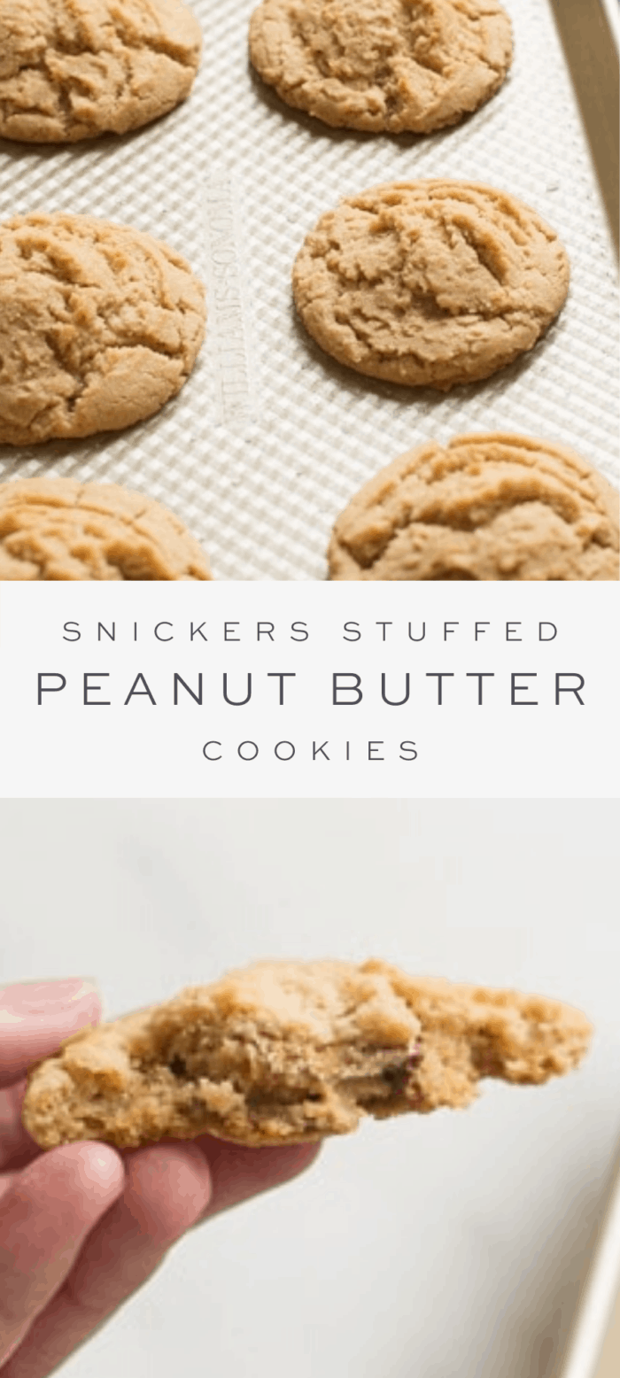 snickers stuffed peanut butter cookies on a sheet pan, overlay text, close up of inside of cookie stuffed with snickers