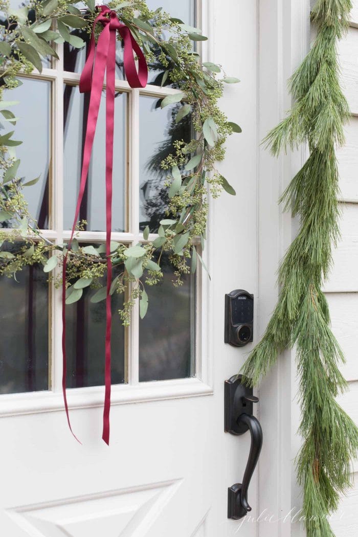 Close up of DIY seeded eucalyptus wreath for Christmas door decor