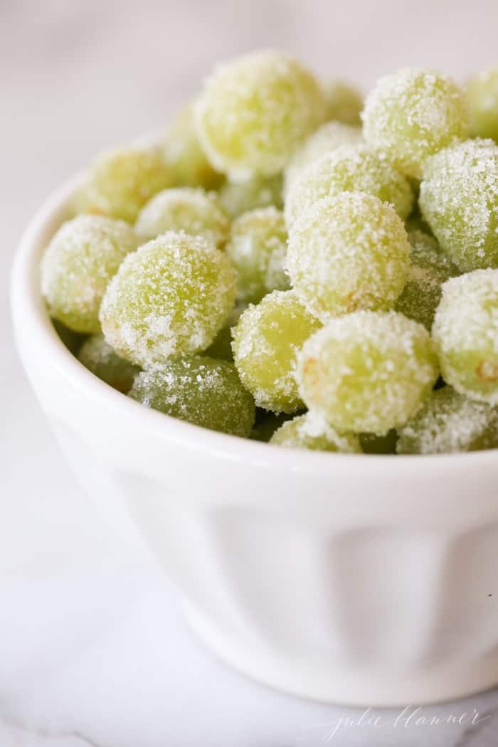 A white bowl full of sugared grapes, a new year's eve recipe